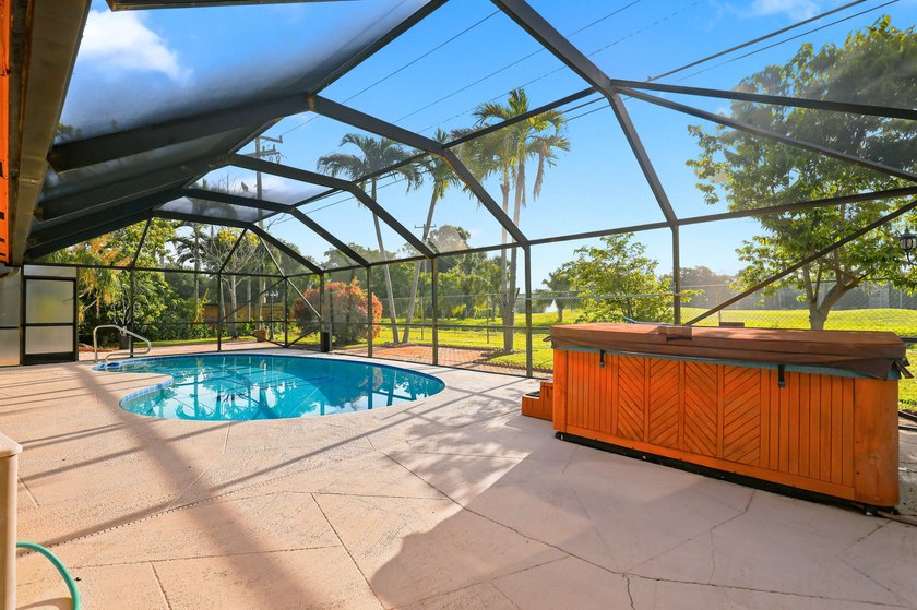 Spacious 4-bedroom, 2-bathroom pool home offering incredible - photo 12
