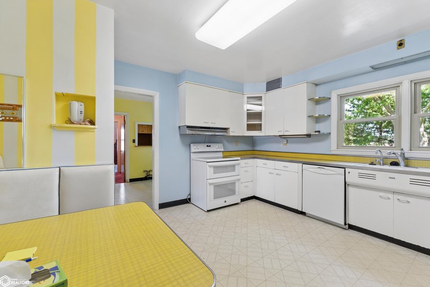 *The Pheasant House on Main* Step into timeless charm with this - photo 10
