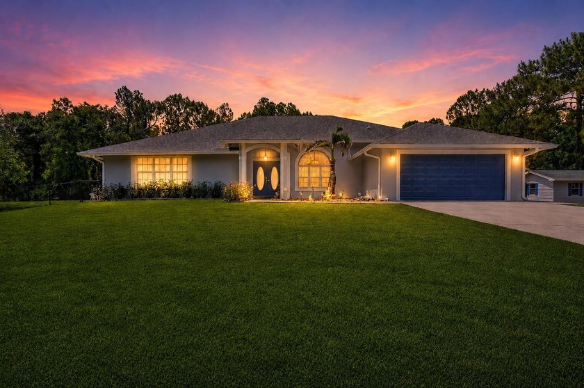 Set on a secluded 2.39-acre corner lot in the heart of - photo 3