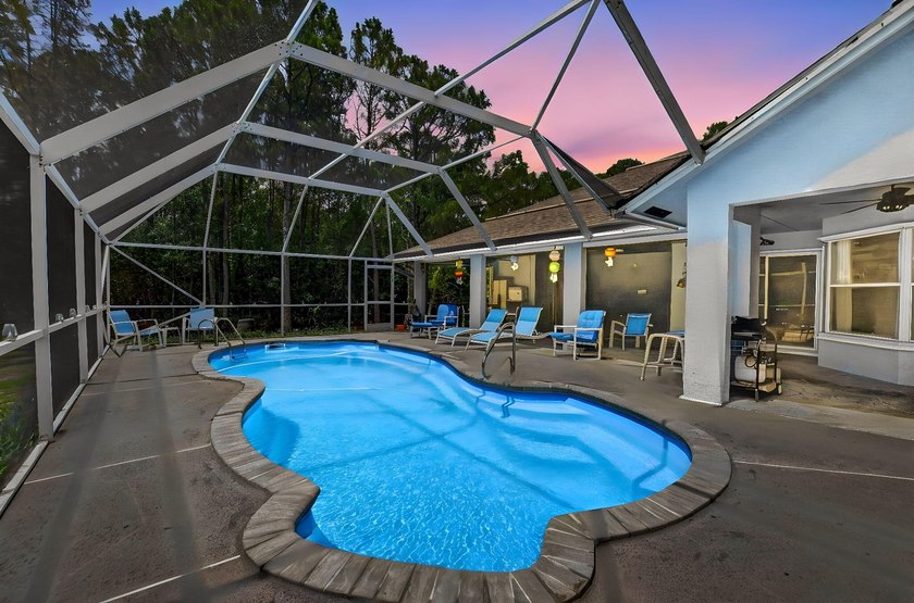 Set on a secluded 2.39-acre corner lot in the heart of - photo 6