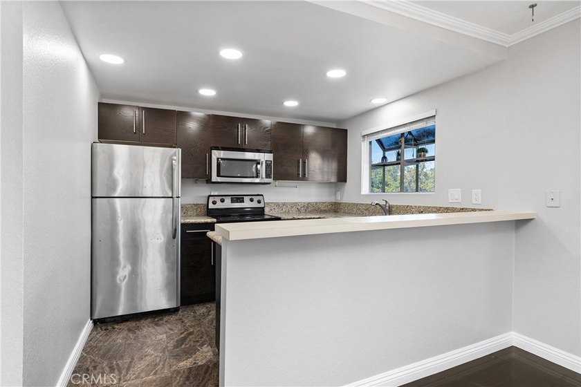 This two-story, townhouse-style condominium offers two primary - photo 11