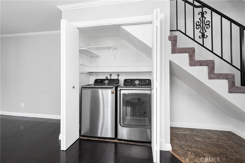 This two-story, townhouse-style condominium offers two primary - photo 16