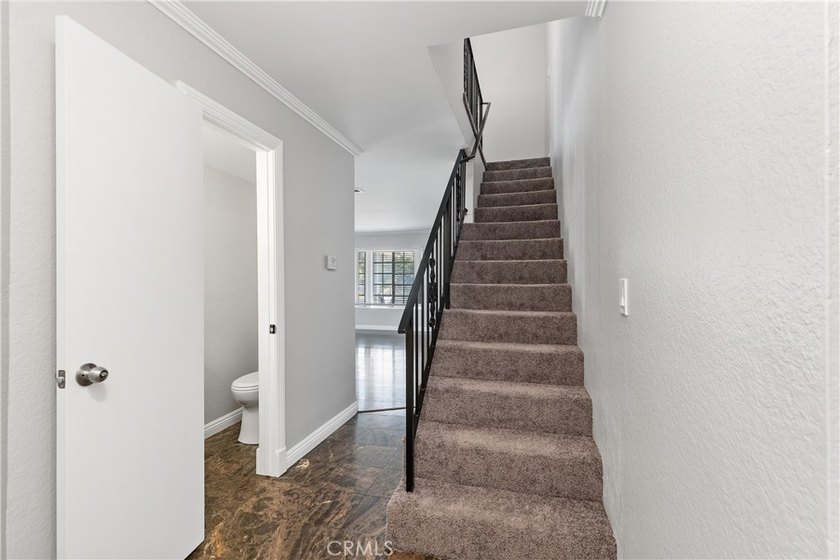 This two-story, townhouse-style condominium offers two primary - photo 18