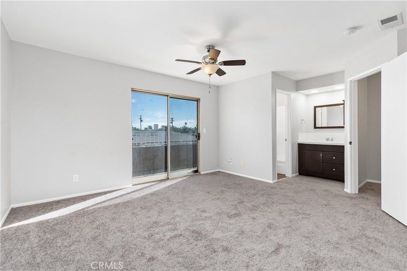 This two-story, townhouse-style condominium offers two primary - photo 19