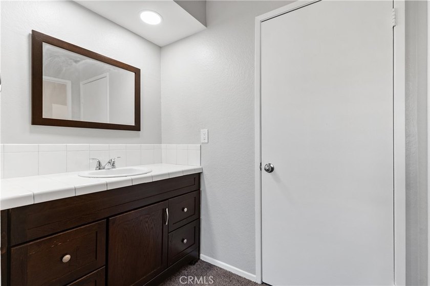 This two-story, townhouse-style condominium offers two primary - photo 30