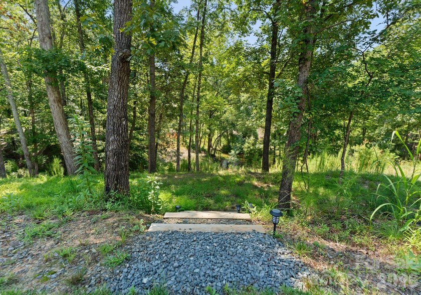 Quietly tucked along the wooded shoreline of Lake Wylie, this - photo 43