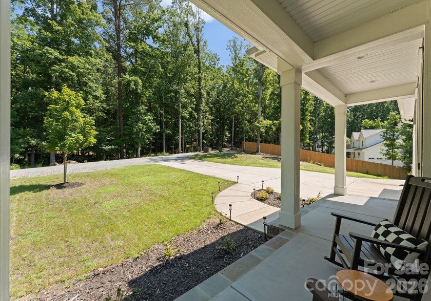 Quietly tucked along the wooded shoreline of Lake Wylie, this - photo 46