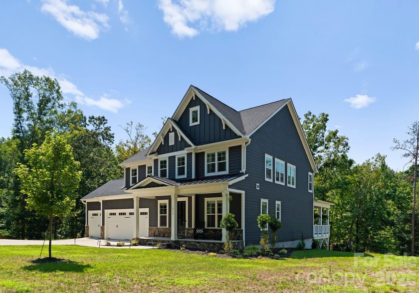 Quietly tucked along the wooded shoreline of Lake Wylie, this - photo 47