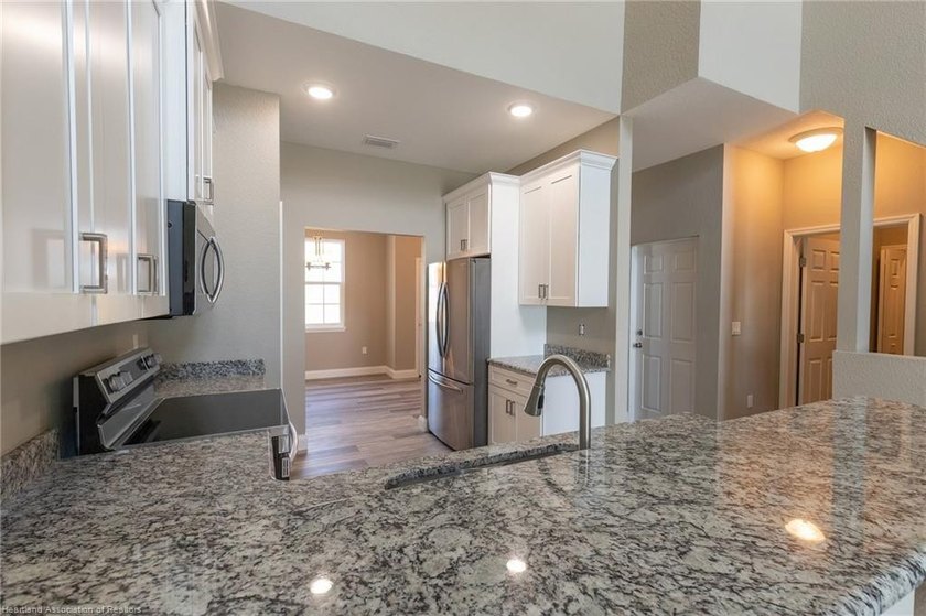 Waterfront townhome development with 3 completed units and over - photo 11