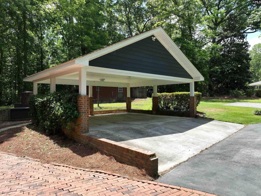 Tucked away on 3.84 sprawling acres with its own private - photo 3