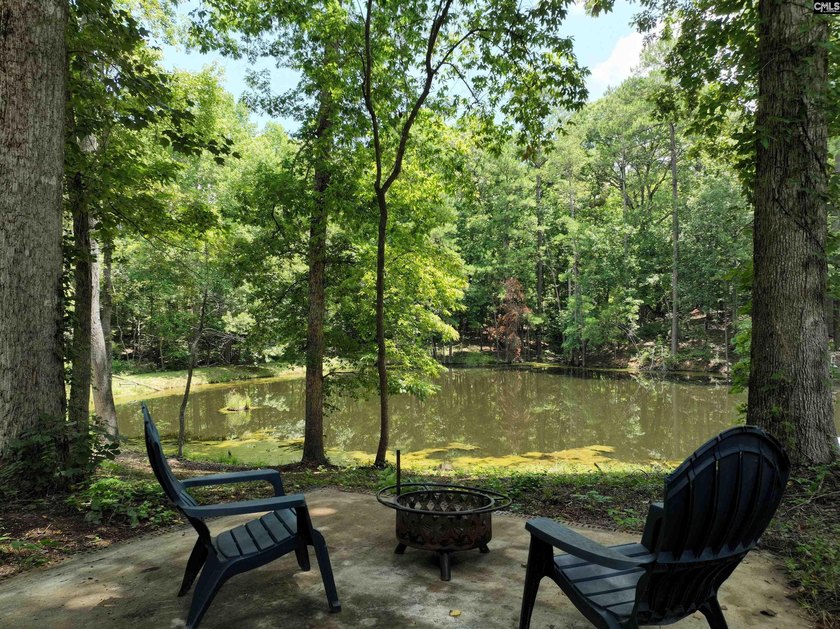 Tucked away on 3.84 sprawling acres with its own private - photo 5
