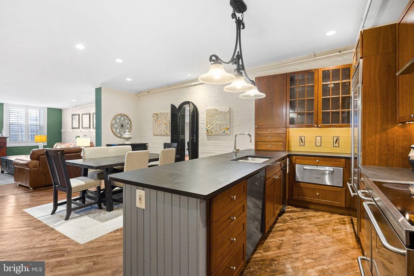 This beautifully updated penthouse offers a unique blend of - photo 3