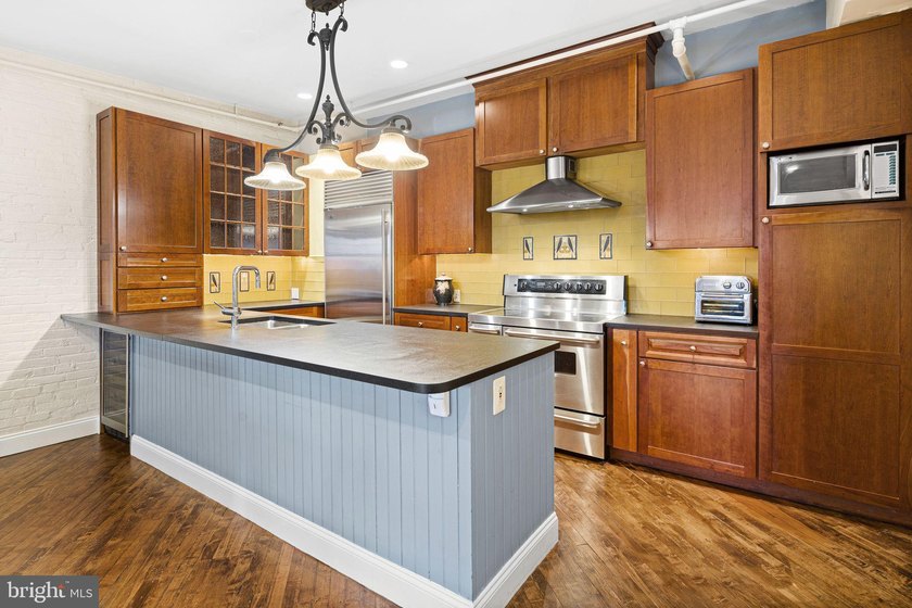 This beautifully updated penthouse offers a unique blend of - photo 6