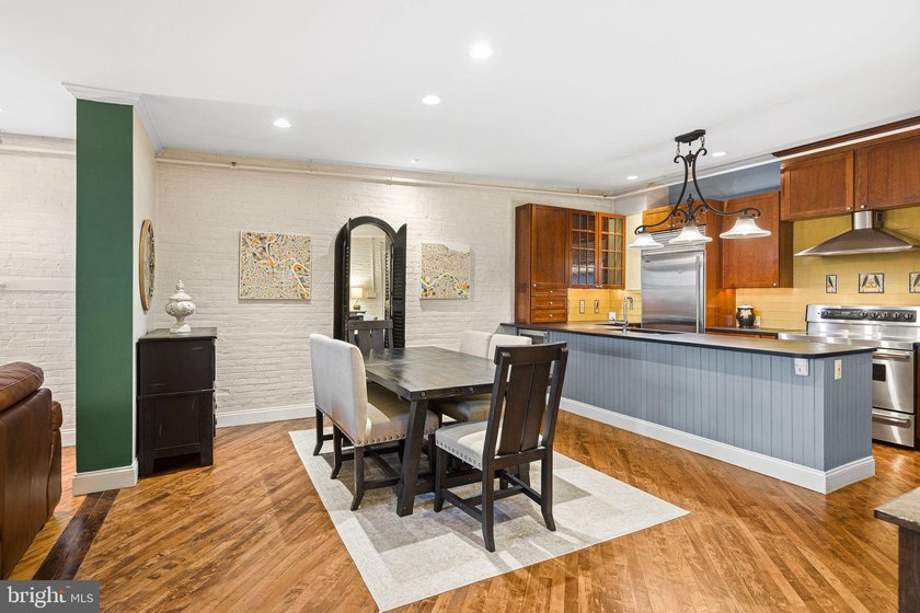 This beautifully updated penthouse offers a unique blend of - photo 8