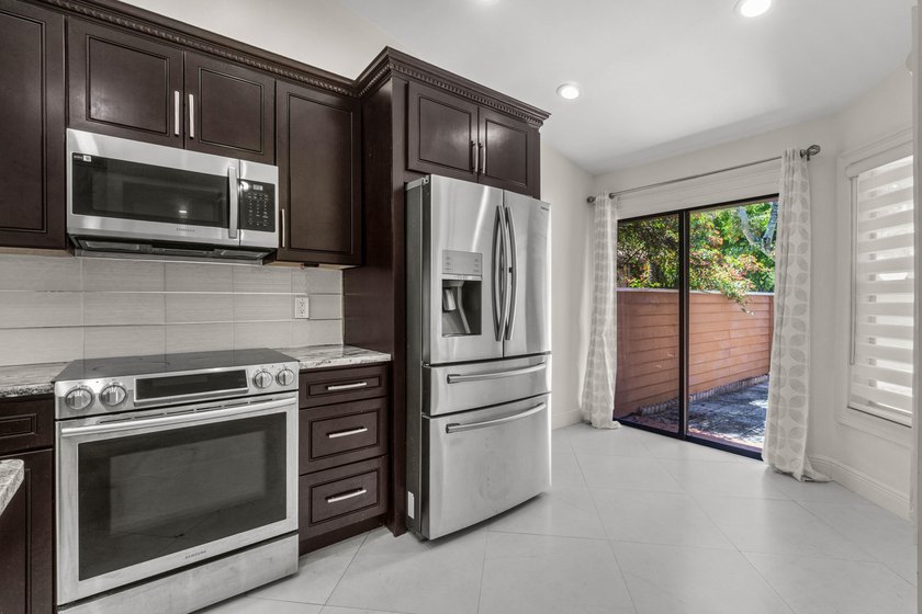 Welcome to this beautifully remodeled townhome, where style - photo 7