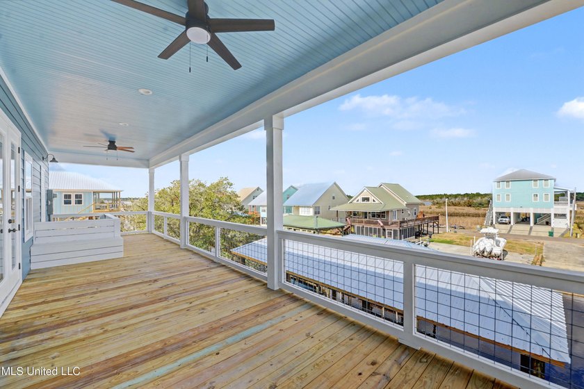 This beautiful Coastal Home offers a timeless blend of Charm and - photo 3