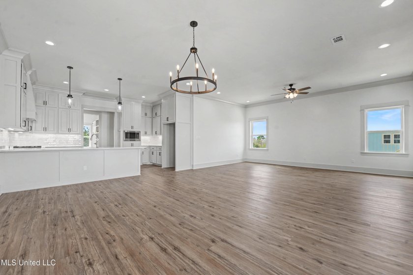 This beautiful Coastal Home offers a timeless blend of Charm and - photo 5