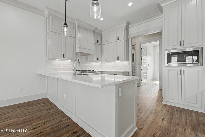This beautiful Coastal Home offers a timeless blend of Charm and - photo 9