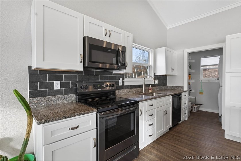 This 3-bedroom, 2.5-bath lakefront home offers over 2,000 square - photo 13