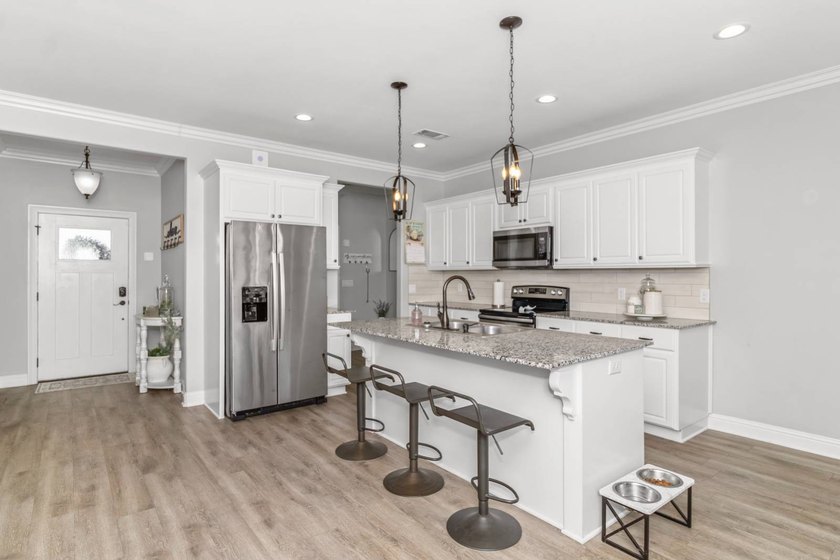 Take a look at this like-new, 3-bedroom, 2-bath home with an - photo 2