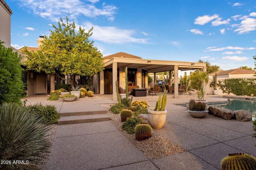 Refined desert living beckons beyond a striking glass gated - photo 9