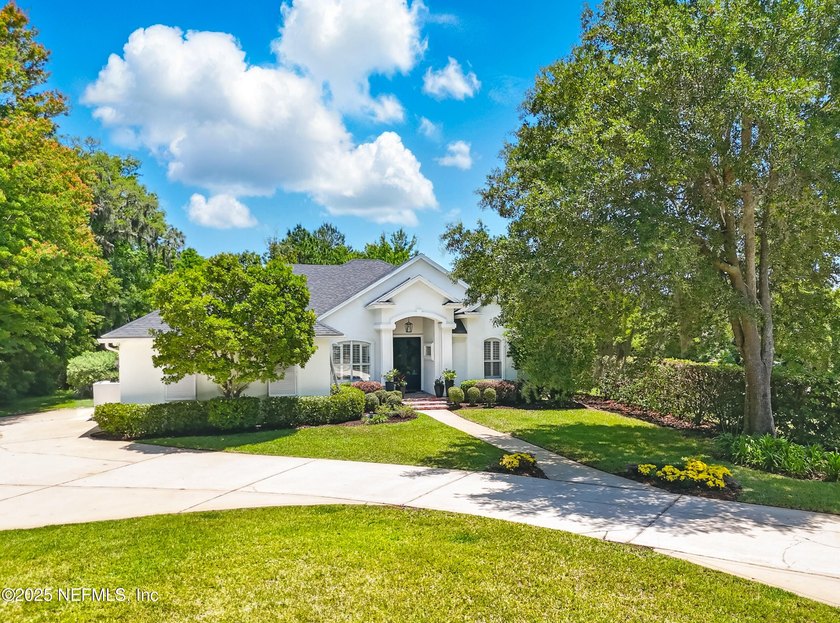 Nestled on a private 1.67-acre estate across from the - photo 5