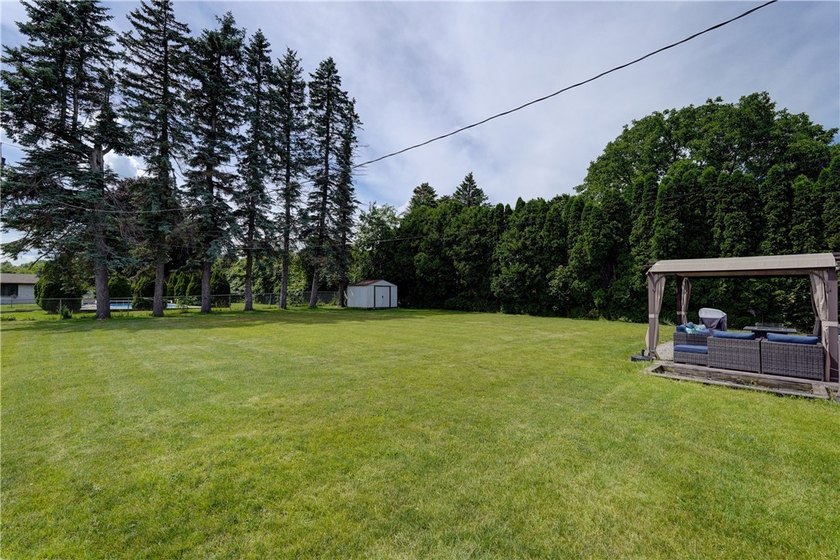 Welcome to 243 Eden Lane in the town of Greece, where this - photo 34