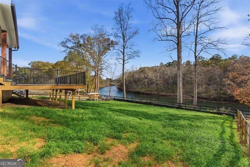 Nestled directly on the banks of the Etowah River, this - photo 48