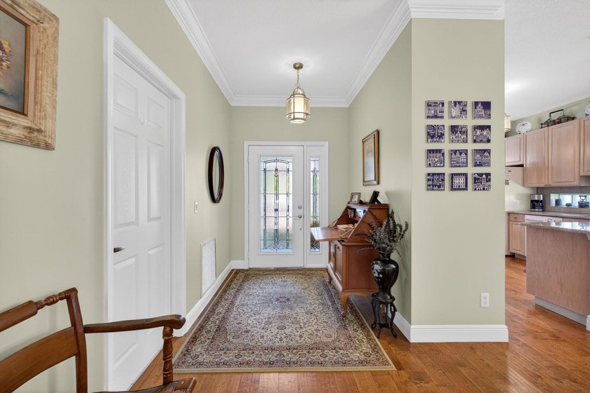 Situated on a large corner lot with lush tropical landscaping - photo 6