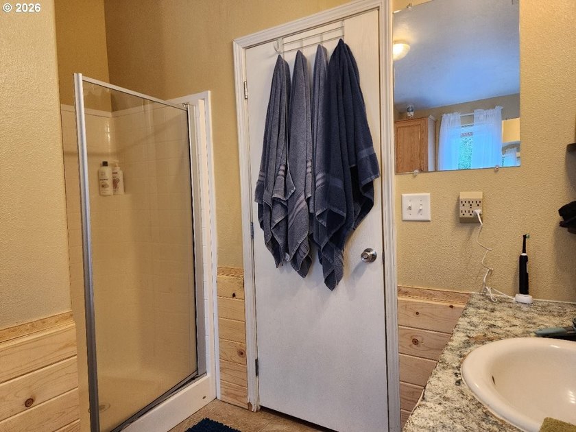 Tucked away among the trees on 1.16 private acres with a Large - photo 15