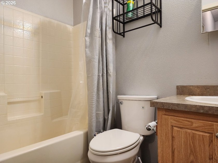 Tucked away among the trees on 1.16 private acres with a Large - photo 18