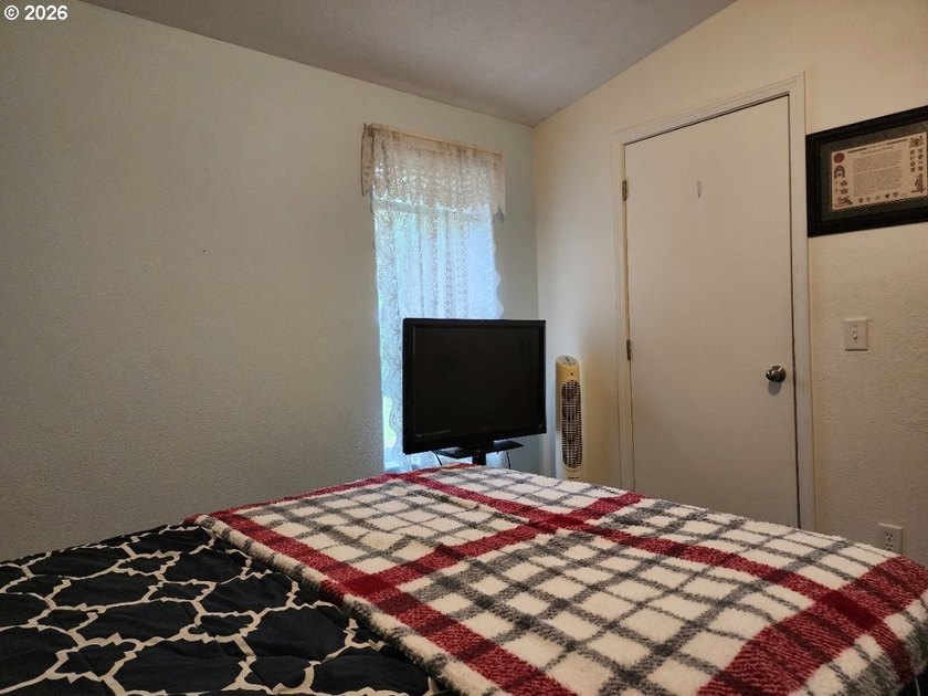 Tucked away among the trees on 1.16 private acres with a Large - photo 20