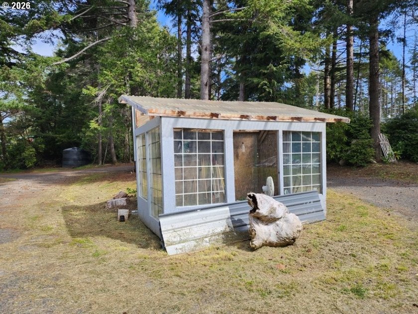 Tucked away among the trees on 1.16 private acres with a Large - photo 24