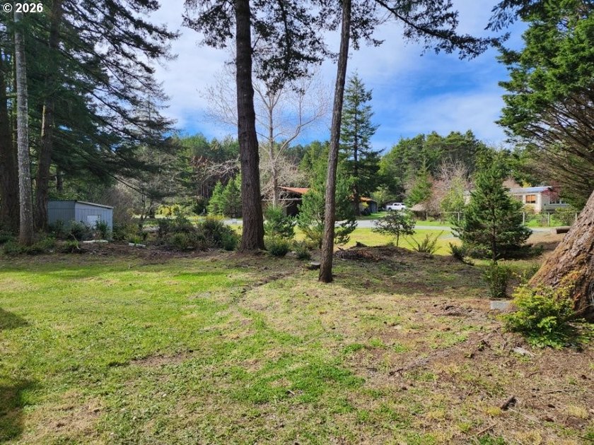 Tucked away among the trees on 1.16 private acres with a Large - photo 26