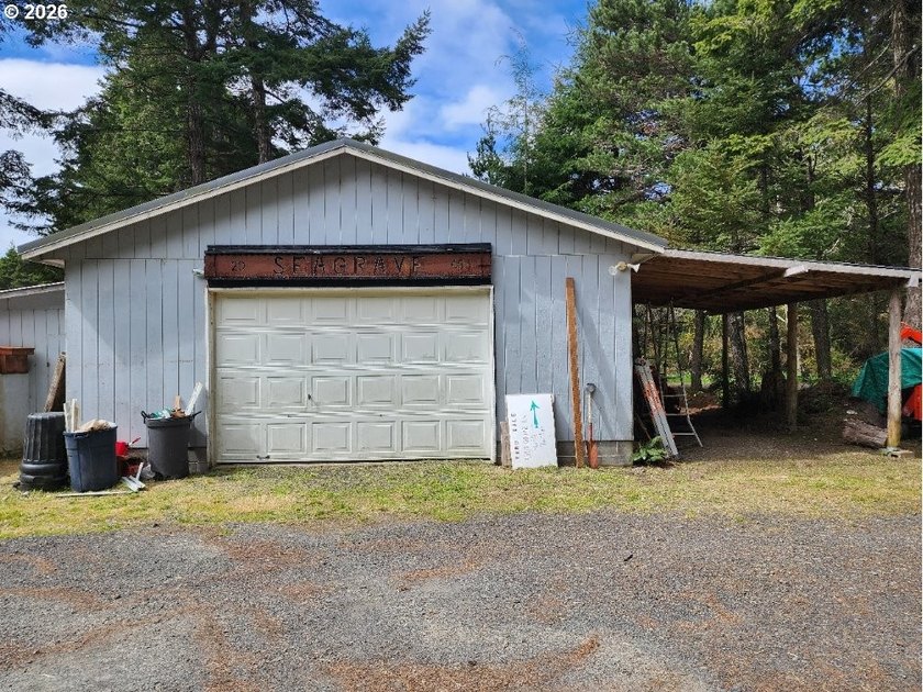 Tucked away among the trees on 1.16 private acres with a Large - photo 27
