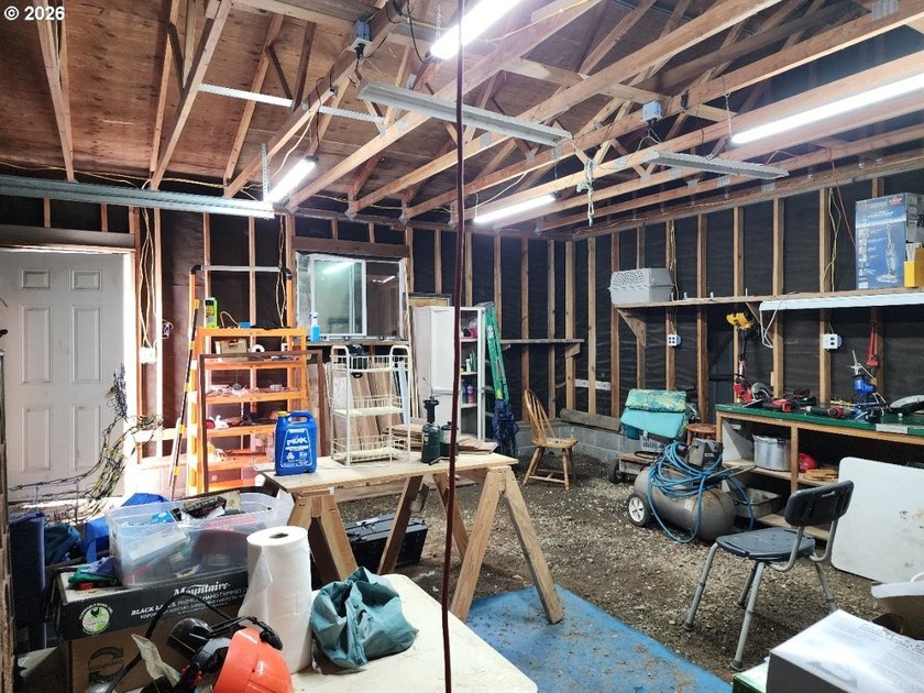 Tucked away among the trees on 1.16 private acres with a Large - photo 29