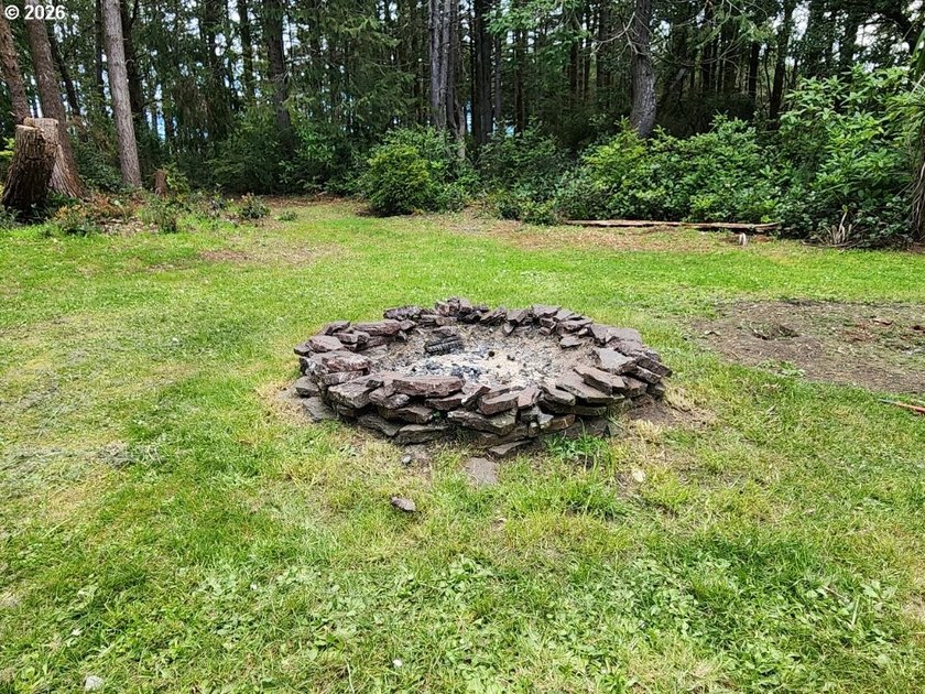 Tucked away among the trees on 1.16 private acres with a Large - photo 30
