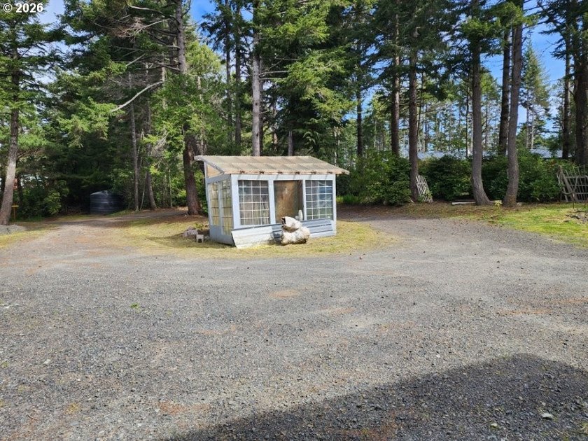 Tucked away among the trees on 1.16 private acres with a Large - photo 31