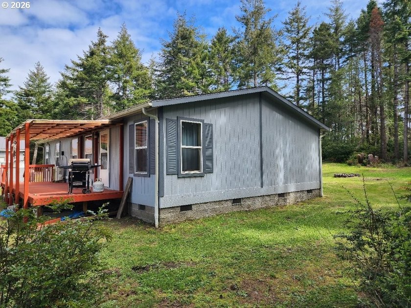 Tucked away among the trees on 1.16 private acres with a Large - photo 32