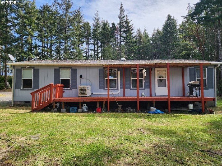 Tucked away among the trees on 1.16 private acres with a Large - photo 33