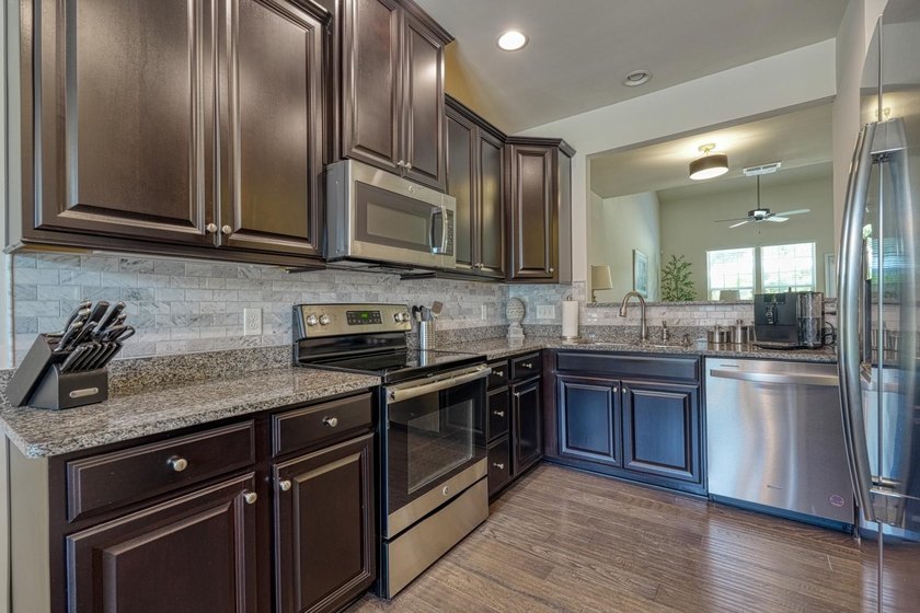 Enjoy low-maintenance living in the highly desirable River Falls - photo 6