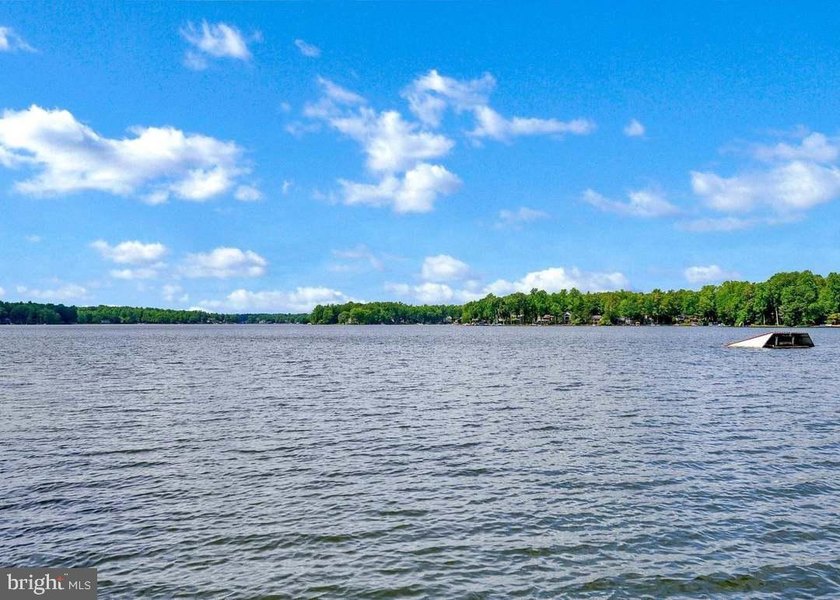 Nestled in the prestigious Lake of the Woods community, this - photo 13