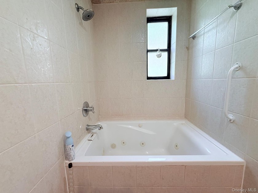 Welcome to this bright and inviting two-bedroom co-op apartment - photo 13