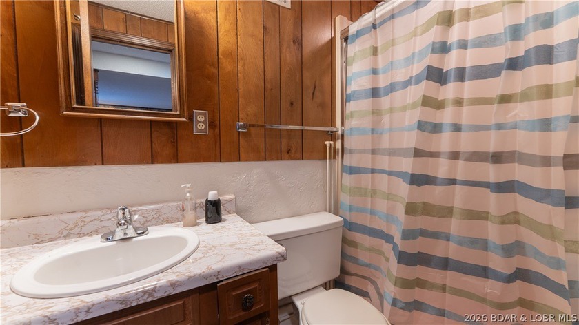 Don't miss this wonderful lake home located at the 8-mile marker - photo 20