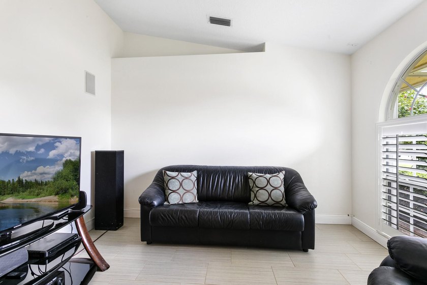 Nestled on a quiet street, this spacious CBS home is designed - photo 3
