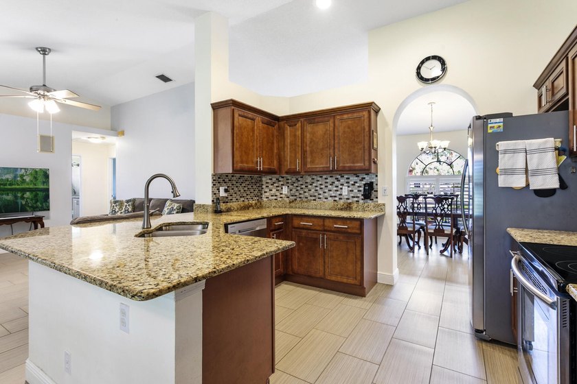 Nestled on a quiet street, this spacious CBS home is designed - photo 7