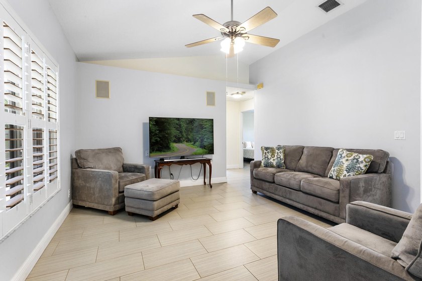 Nestled on a quiet street, this spacious CBS home is designed - photo 8