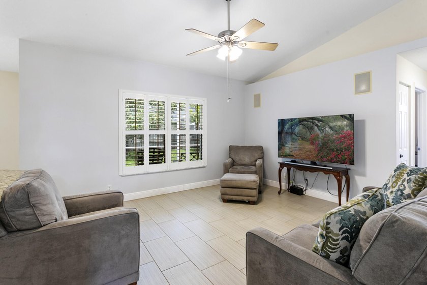 Nestled on a quiet street, this spacious CBS home is designed - photo 9
