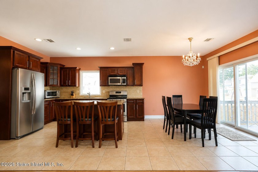 This gorgeous 2-family, 4-bedroom, 3-bathroom, side-hall - photo 14