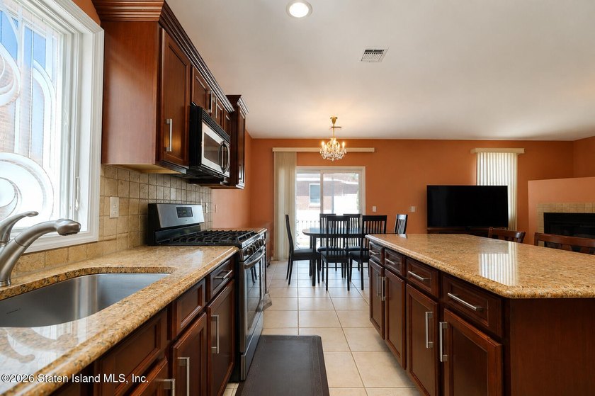 This gorgeous 2-family, 4-bedroom, 3-bathroom, side-hall - photo 18